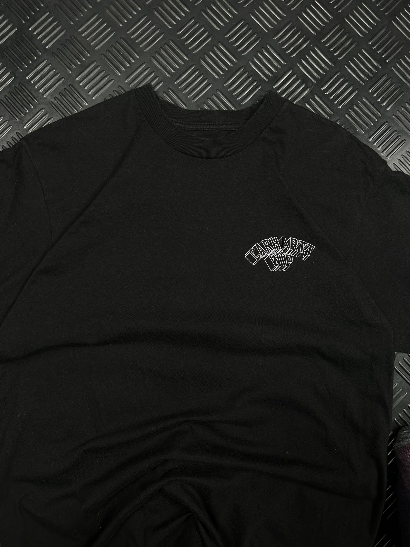 Detalle de logotipo Carhartt WIP en el pecho