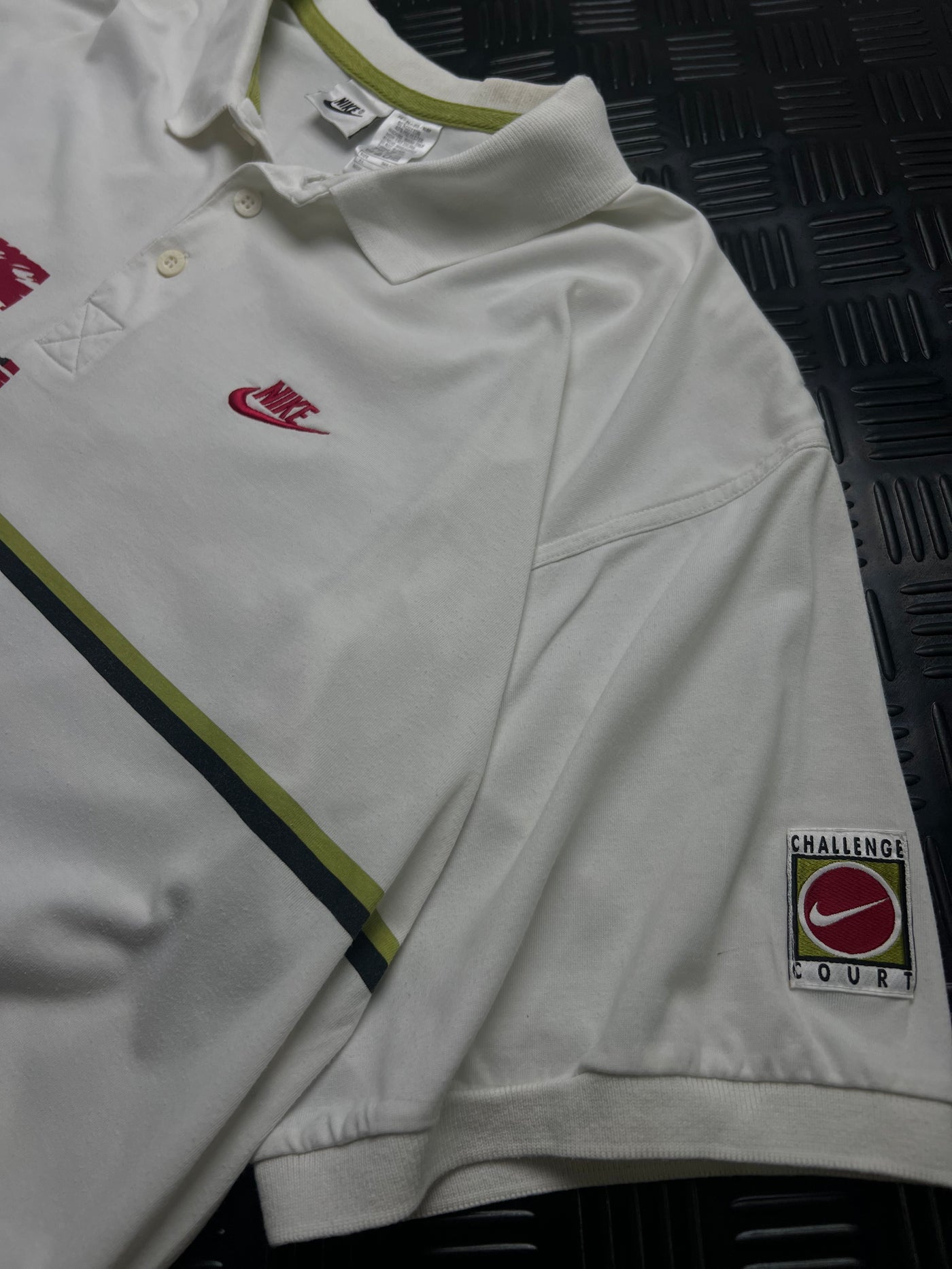 Detalle de polo nike challenge court vintage