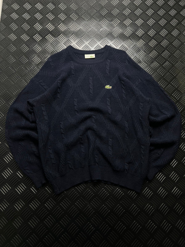 Lacoste: Jersey azul marino con detalles trenzados